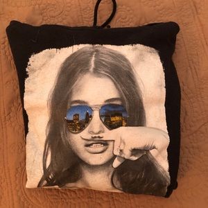 girl with mustache finger sweatshirt